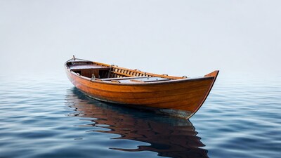 Wooden rowboat on calm water