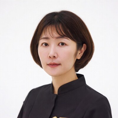 Asian woman in black uniform