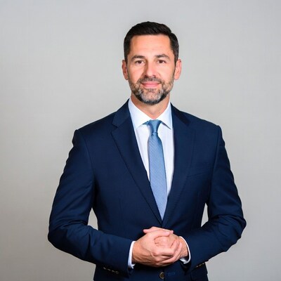 Man in navy suit with beard