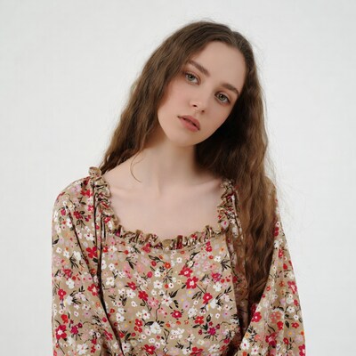Woman in floral dress with wavy hair