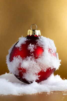 Red Christmas ornament with snow