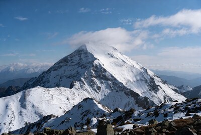 Snowy Mountain Peak with Clouds