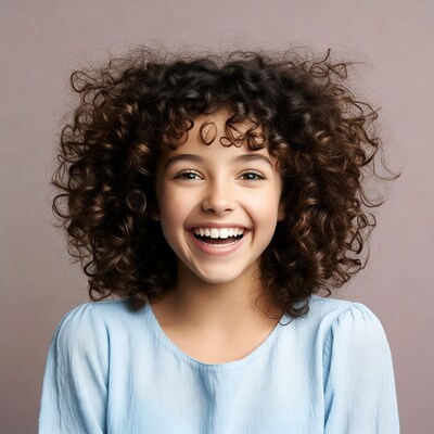 Girl with curly hair smiling