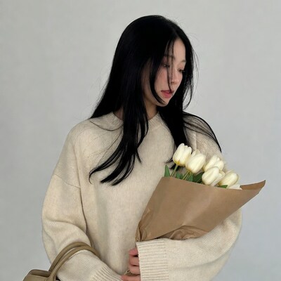Asian woman holding white tulips