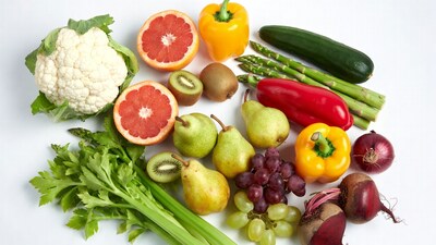 Fresh vegetables and fruits on white background