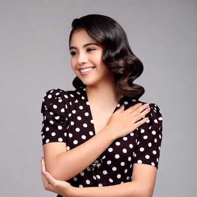 Smiling Latina woman in polka dot dress