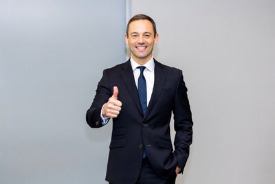 Man in suit giving thumbs up