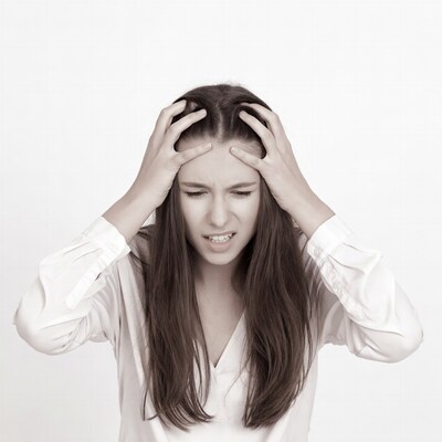 Woman pulling hair in frustration