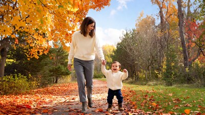 Mother holding toddler hand fall path