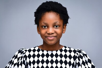 African girl in checkered dress smiling