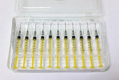 Yellow syringes in clear tray