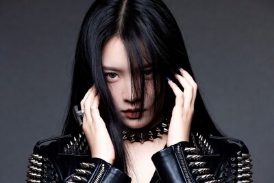 Asian woman in spiked leather jacket