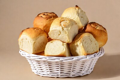 Fresh bread rolls in white basket