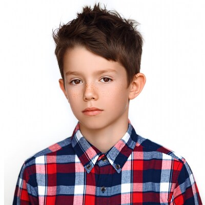 Boy with freckles in plaid shirt