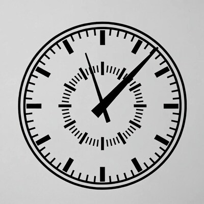 Black analog clock on gray background