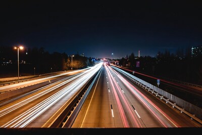 Night highway with light trails