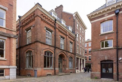 Historic Brick Buildings in Cobblestone Courtyard