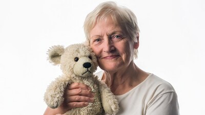 Elderly woman hugging teddy bear