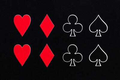 Red Hearts and Diamonds with Black Clubs Spades
