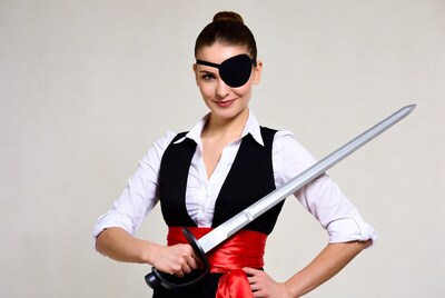 Woman in pirate costume holding sword