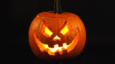 Lit Jack-o-Lantern on Black Background