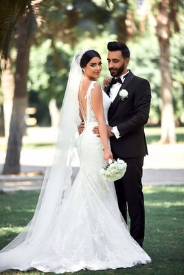 Bride and groom embracing outdoors