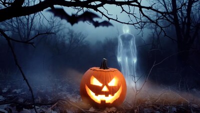 Jack-o-lantern with ghost in foggy forest
