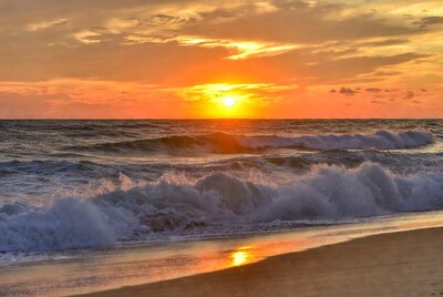 Sunset over ocean waves