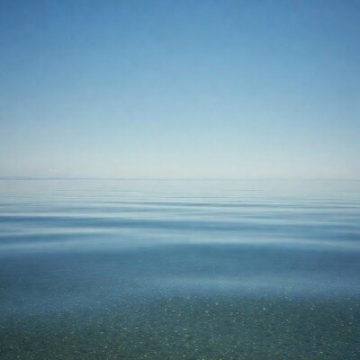 Calm lake water under blue sky