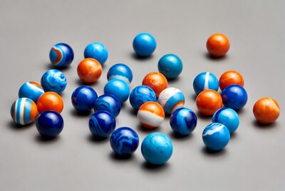 Colorful Blue Orange Marbles on Gray