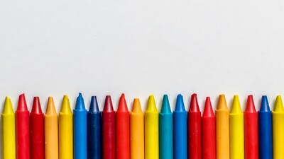 Colorful Crayons Lined on White Background