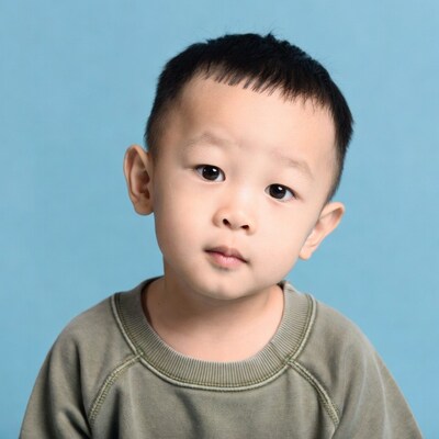 Asian boy with curious expression