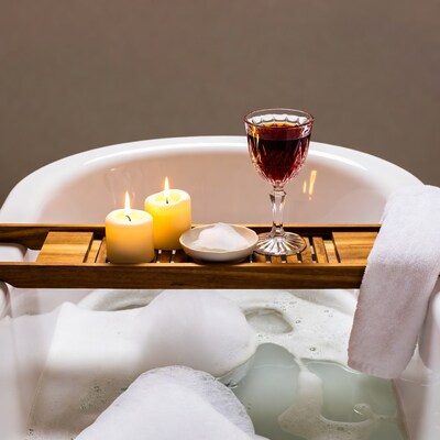 Bathtub with candles wine glass