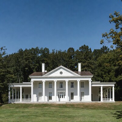 White columned mansion with porches