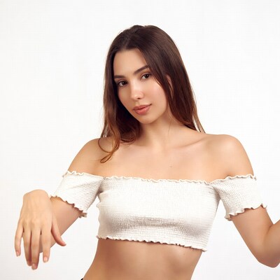 Woman in off-shoulder white top