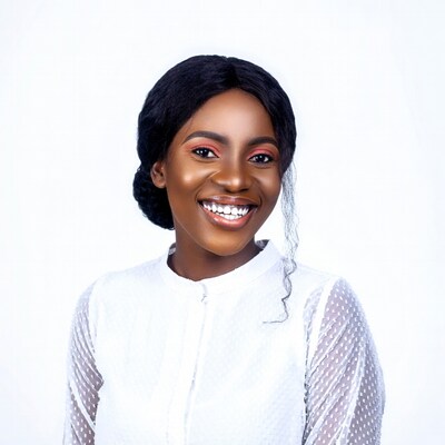 Smiling African woman in white blouse