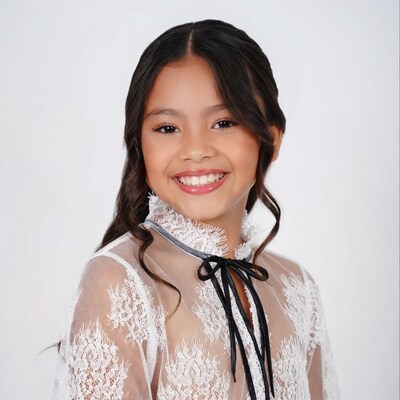 Asian girl in lace blouse smiling