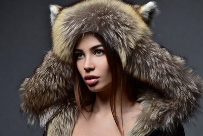 Woman wearing fox fur hat