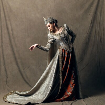 Woman in silver gown with crown