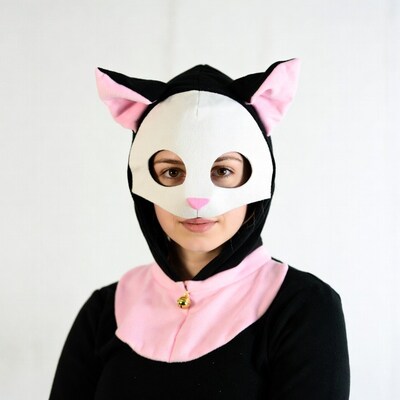 Woman wearing cat mask costume