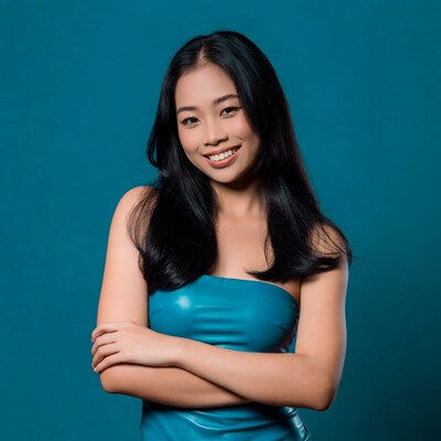 Asian woman smiling with arms crossed