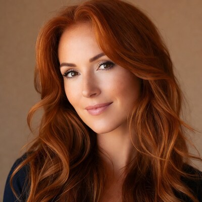 Woman with long red hair smiling