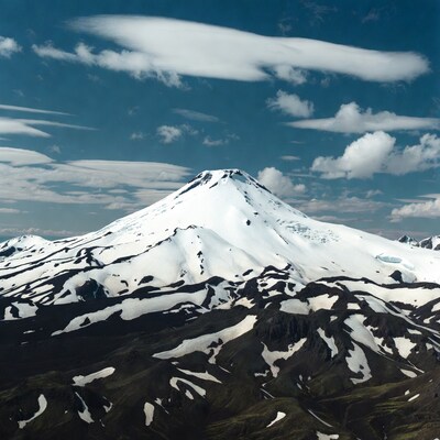 Snowy volcano under blue sky