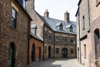 Cobblestone Courtyard with Brick Buildings