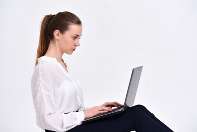 Woman typing on laptop