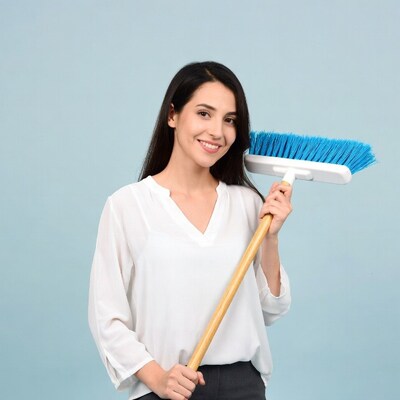 Woman holding blue broom