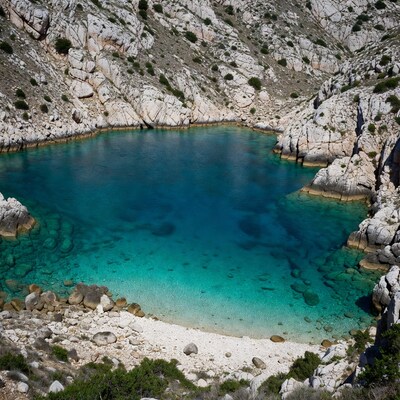 Turquoise lagoon in rocky cliffs
