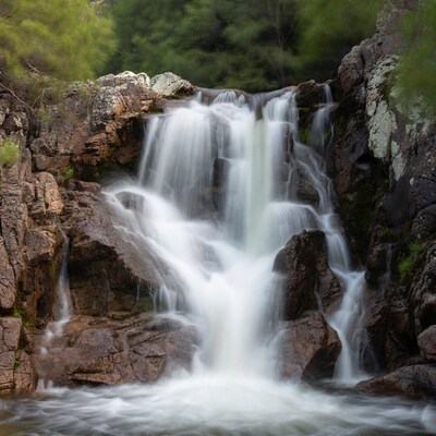 Waterfall cascading over mossy rocks