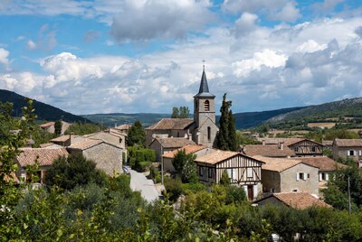 French village with church and hills