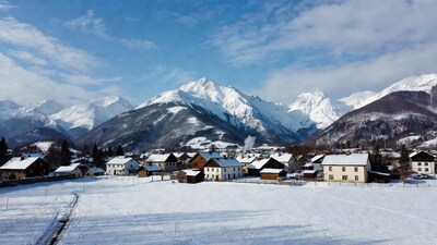 Snowy Alpine Village with Mountains